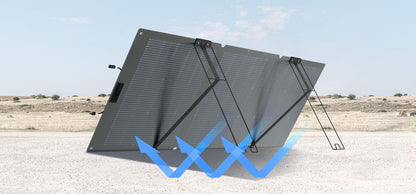 Folding solar panel on a desert landscape with blue arrows indicating solar capture