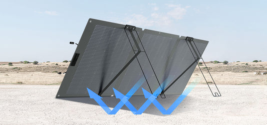 Folding solar panel on a desert landscape with blue arrows indicating solar capture