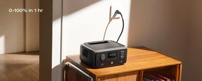 Portable power station on a wooden table with a neutral background