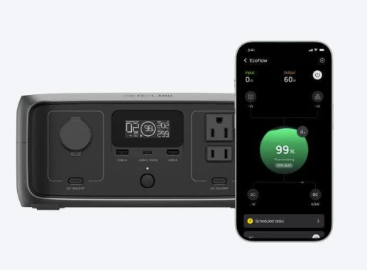 Power station with multiple outlets and USB ports, alongside a smartphone displaying a charging app.